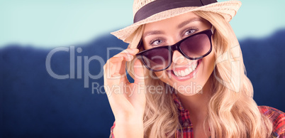 Composite image of gorgeous smiling blonde hipster posing with s