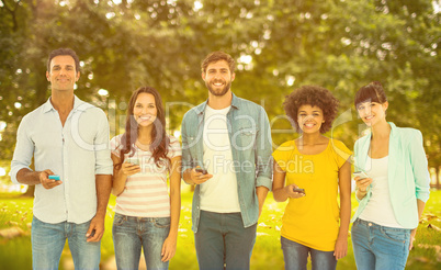 Composite image of creative colleagues with smartphones