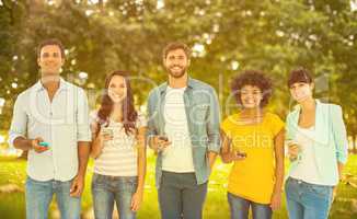 Composite image of creative colleagues with smartphones