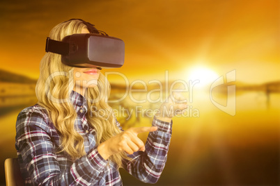 Composite image of pretty casual worker using oculus rift