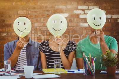 Composite image of casual people sitting on couch with smile hea