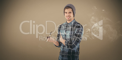 Composite image of portrait of happy man holding smoking pipe