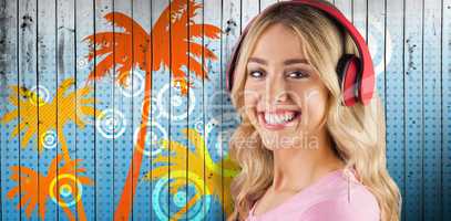 Composite image of portrait of a beautiful young woman with headphones