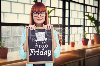 Composite image of smiling hipster woman holding blackboard