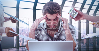 Composite image of businessman stressed out at work