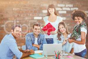 Composite image of smiling casual colleagues in a meeting