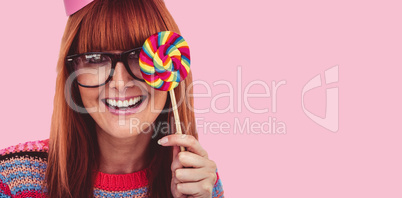 Composite image of smiling hipster woman with lollipop and hat p