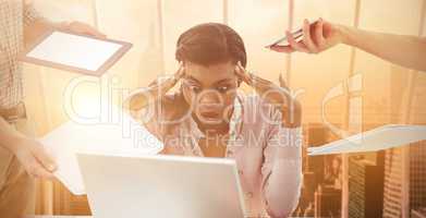 Composite image of businesswoman stressed out at work