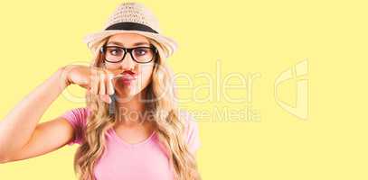 Composite image of a beautiful hipster having a fake distinguish