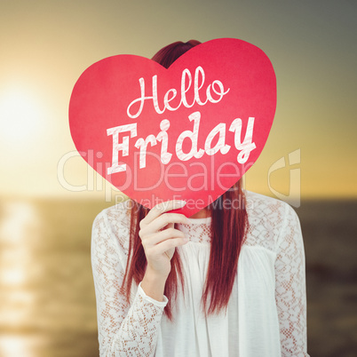 Composite image of smiling hipster woman behind a big red heart