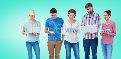 Composite image of group of young colleagues using laptop and ta