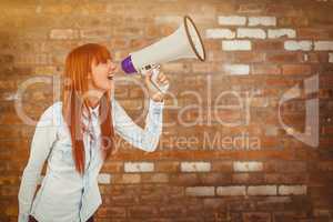 Composite image of hipster smiling woman through megaphone