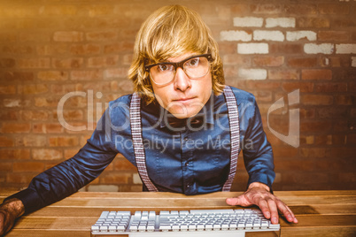Composite image of hipster businessman looking closely the camer
