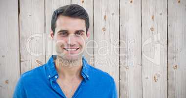 Composite image of handsome man smiling to the camera