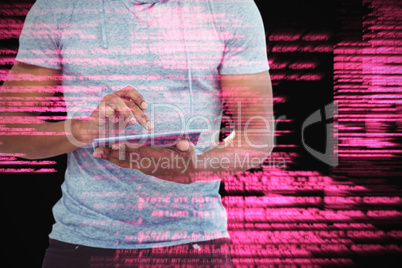 Composite image of mid section of man using tablet