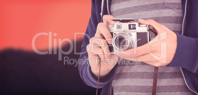 Composite image of mid section of man with camera