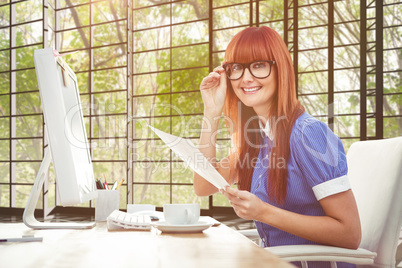 Composite image of smiling hipster woman with document