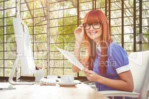 Composite image of smiling hipster woman with document