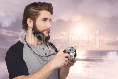 Composite image of hipster using digital camera