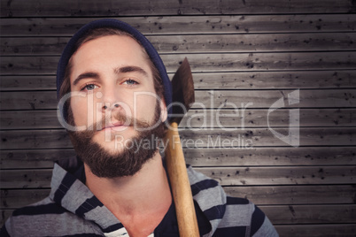 Composite image of close-up portrait of hipster with hooded shir