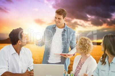 Composite image of group of young colleagues in a meeting