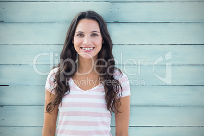 Composite image of brunette smiling to the camera