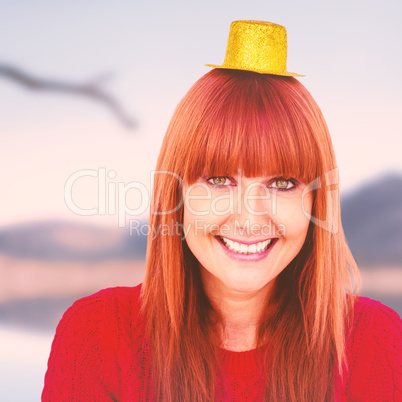 Composite image of smiling hipster woman with party hat