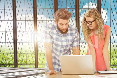 Composite image of man using laptop while discussing with woman