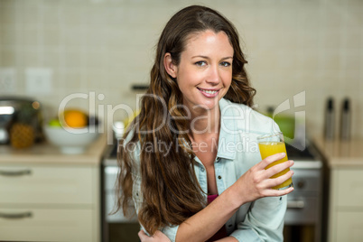 Portrait of young woman drinking juice