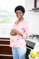 Pregnant woman holding glass of water