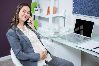 Pregnant woman on the phone