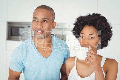 Peaceful couple standing in the kitchen