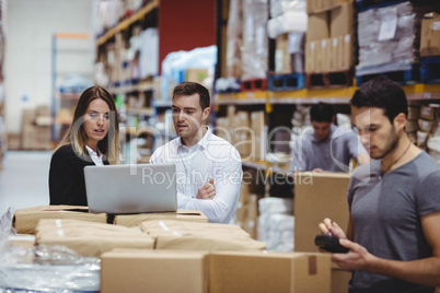 Portrait of smiling warehouse managers