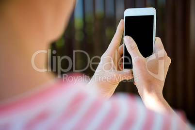 female hands typing on a smartphone