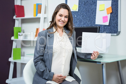 Portrait of pregnant businesswoman