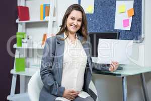 Portrait of pregnant businesswoman