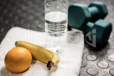 Fruit, water and dumbbells