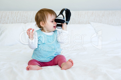 adorable baby playing with headphones