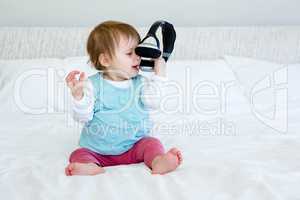 adorable baby playing with headphones