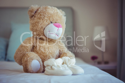 View of teddy bear and baby socks