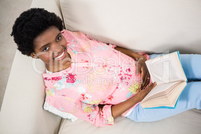 Pregnant woman reading a book