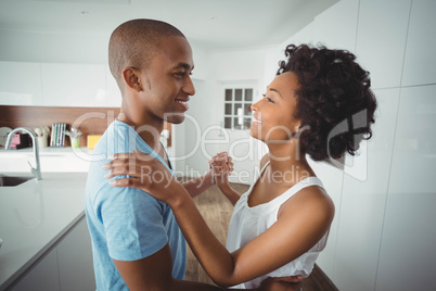 Happy couple dancing in the kitchen Happy couple dancing in the kitchen