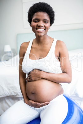 Pregnant woman rubbing her belly