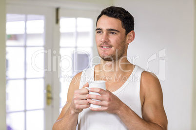 Young man holding a cup of tea