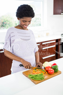 Pregnant woman preparing vegetables