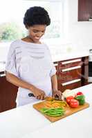 Pregnant woman preparing vegetables