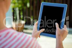 female hands scrolling on a tablet computer