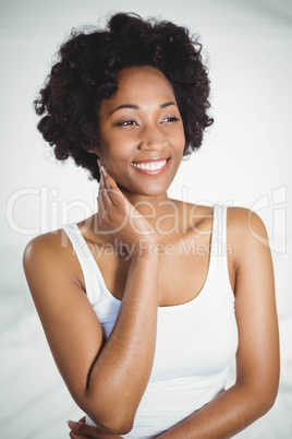 Portrait of smiling brunette in bedroom