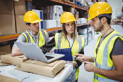 Portrait of smiling warehouse managers