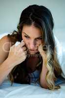 woman holding a tissue and looking upset